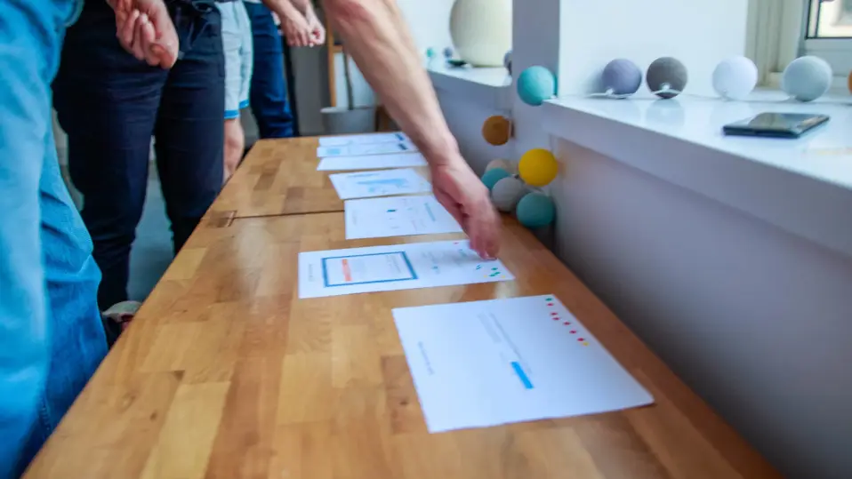 A participant voting for the design ideas they prefer