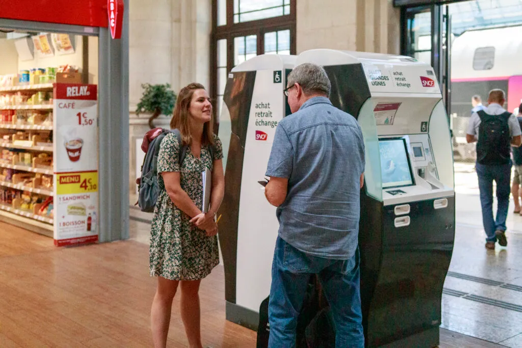 A team member during a street interview at a station