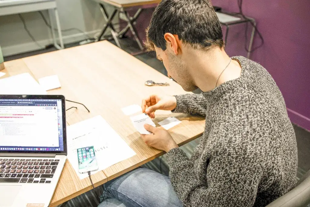 A tester reading through the test instructions