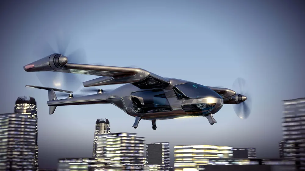 Futuristic twin propeller aircraft flying past illuminated buildings