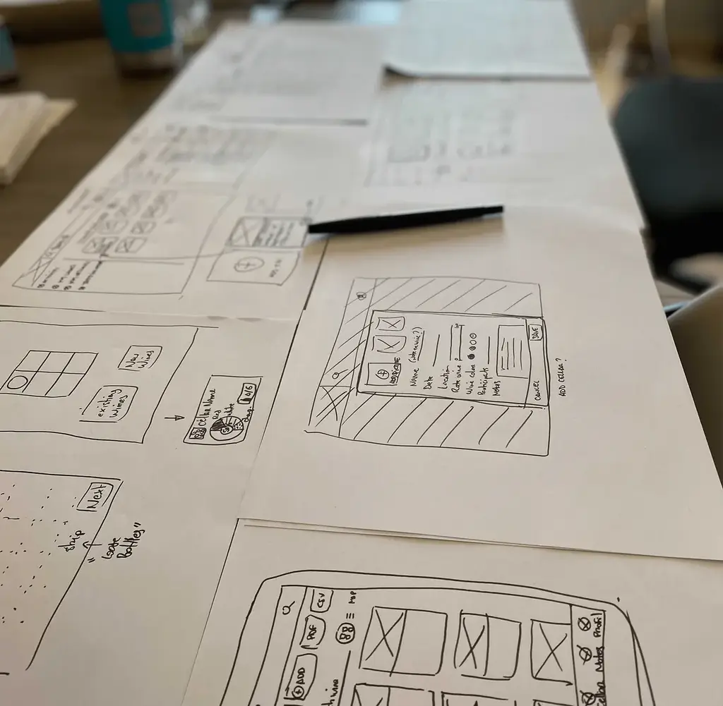 Desk with several papers and sketches