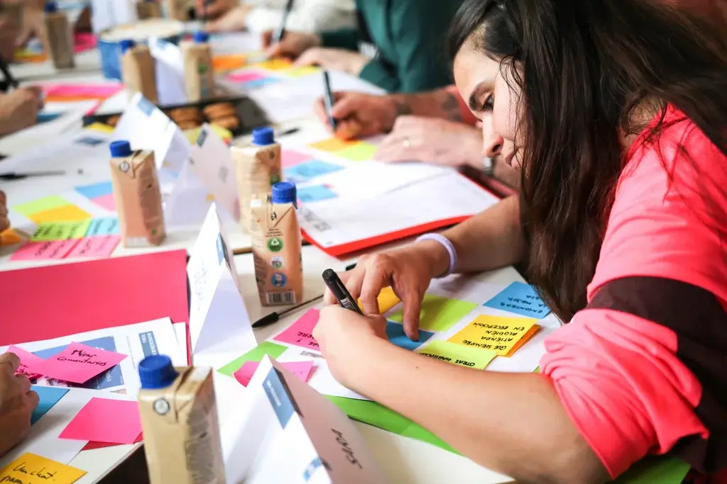 Focus-group participant noting her ideas on sticky notes