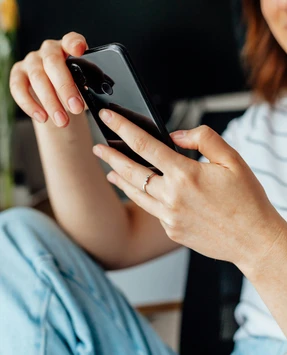 Close-up of a person's hands holding a smartphone.