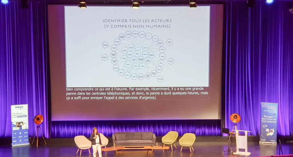 Keynote slide on systemic design, calling for the identification of all stakeholders, including non-humans, in the design process.