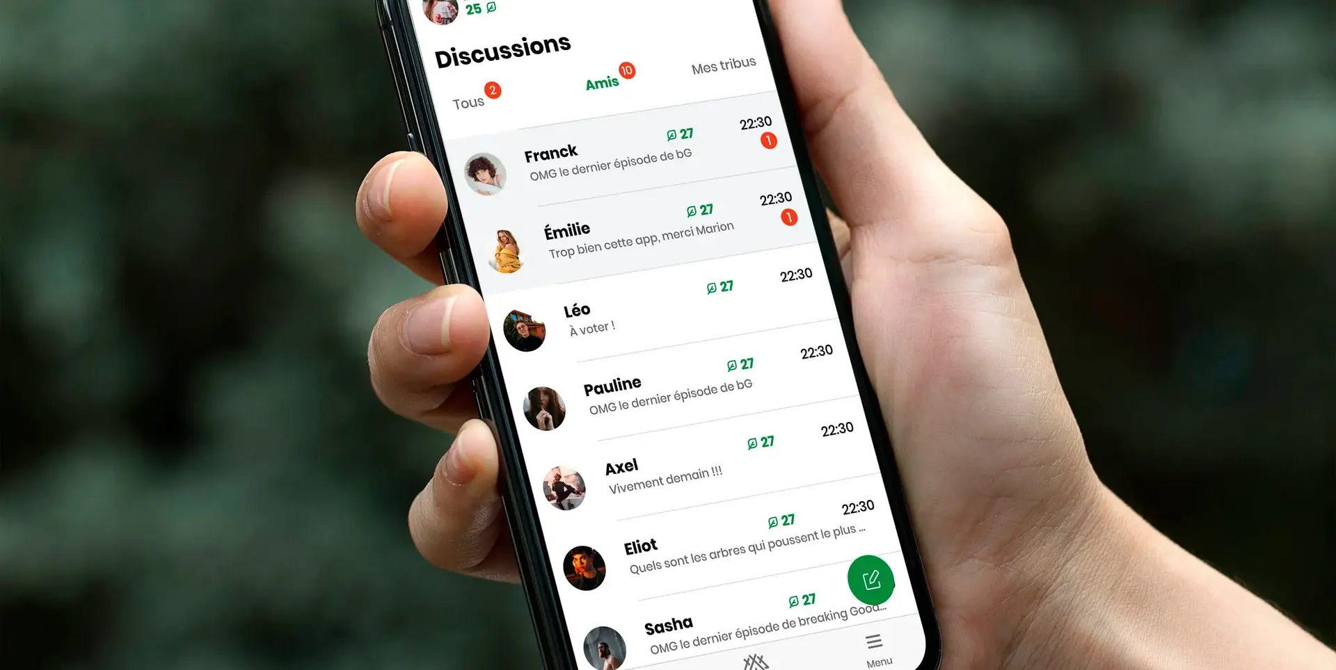 Hand holding a smartphone displaying the Treebal app conversation list
