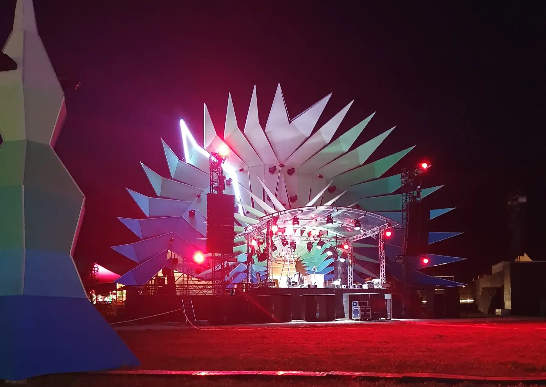 Paléo stage with illuminated geometric decoration at night