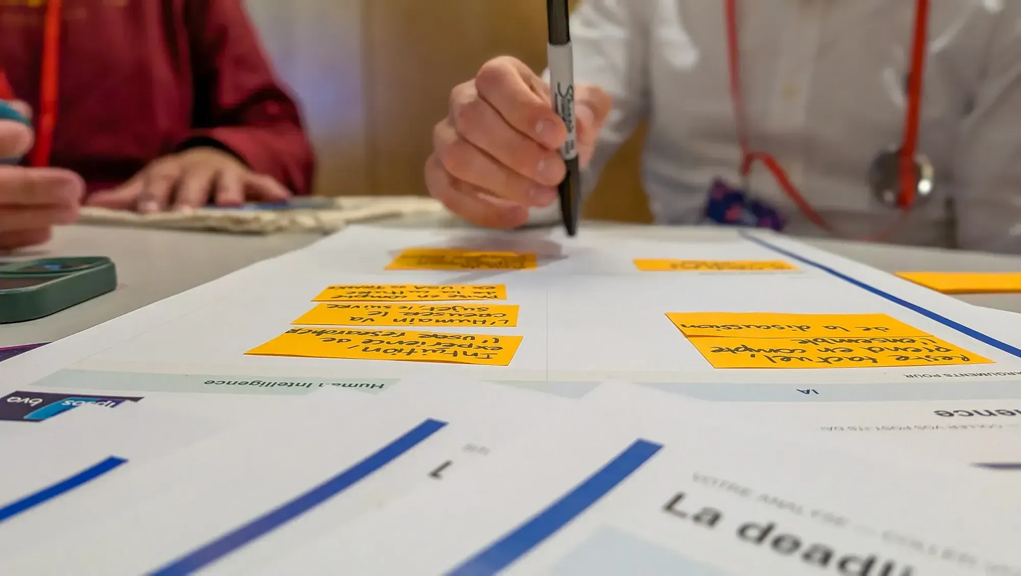 Participant annotating cards during the workshop on the AI writing assistant