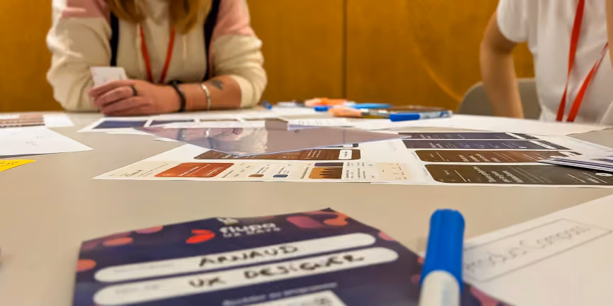 Participants autour d'une table pendant un atelier des UX Days 2026