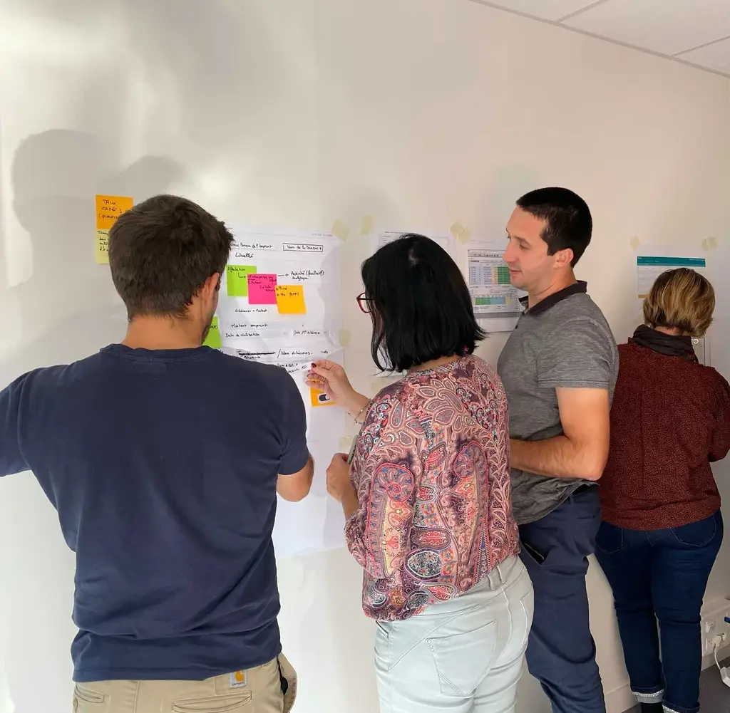 Participants structuring the pages during the screen co-design workshop
