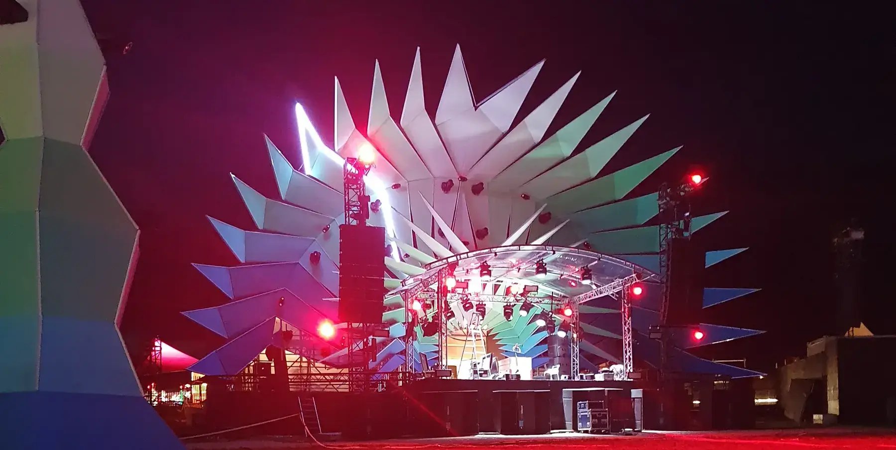 Paléo stage with illuminated geometric decoration at night