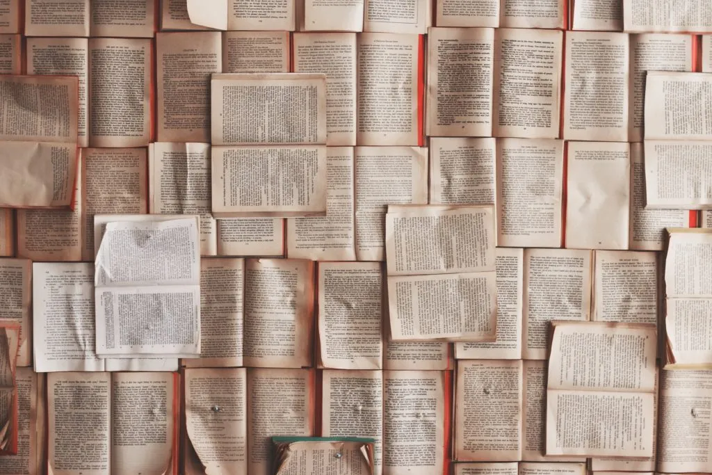 Several open books on the floor