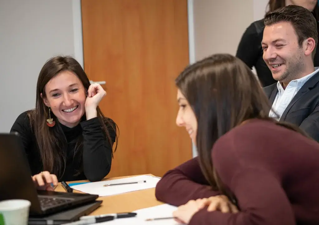 Several participants laughing during the workshop