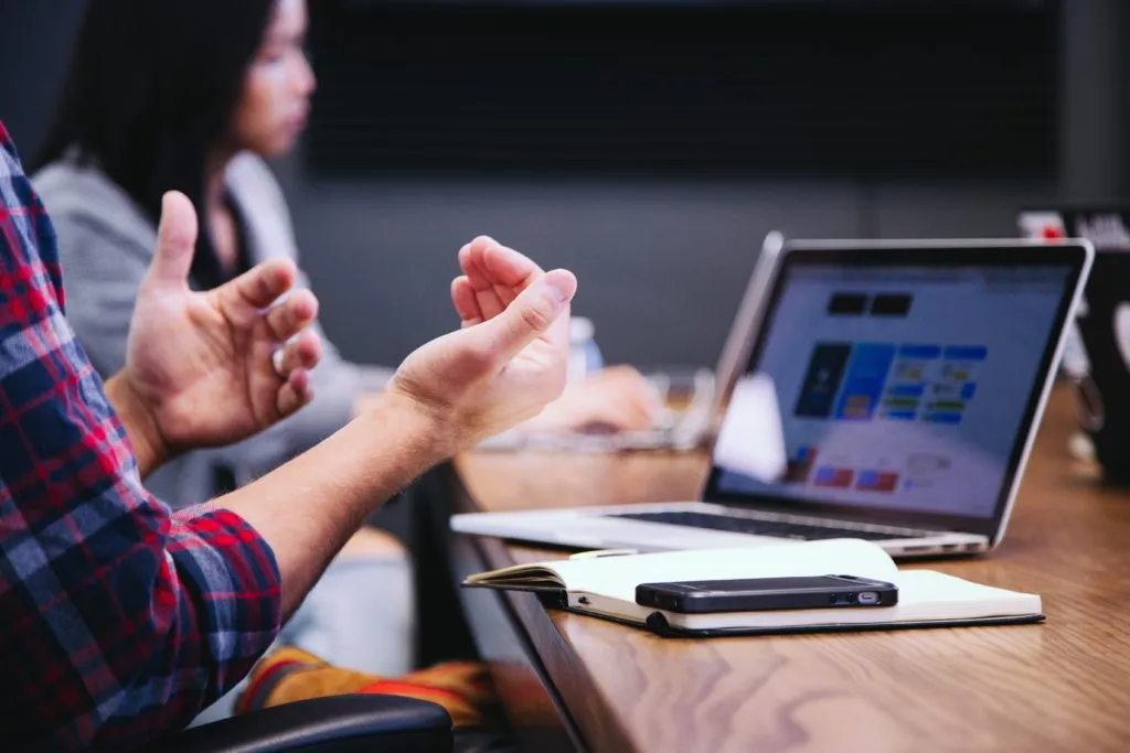 Strategic UX: a meeting with several people around a table