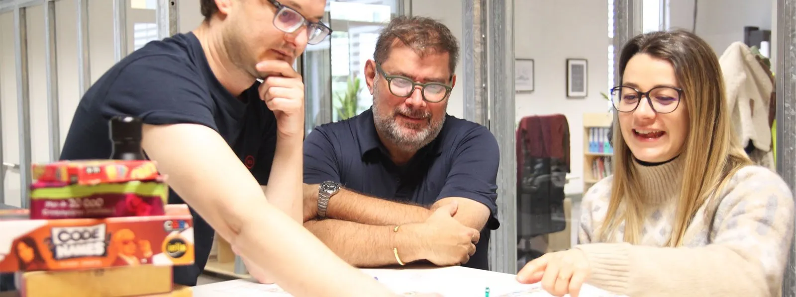 The Akiani team around a games table